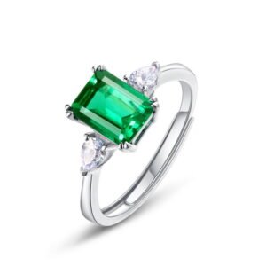 SYMARA’s white gold plated S925 silver princess cut lab grown emerald ring for women with cubic zirconia side stones.