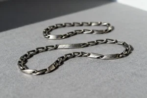 Before and after: platinum necklace deep cleaning and polishing results at SYMARA