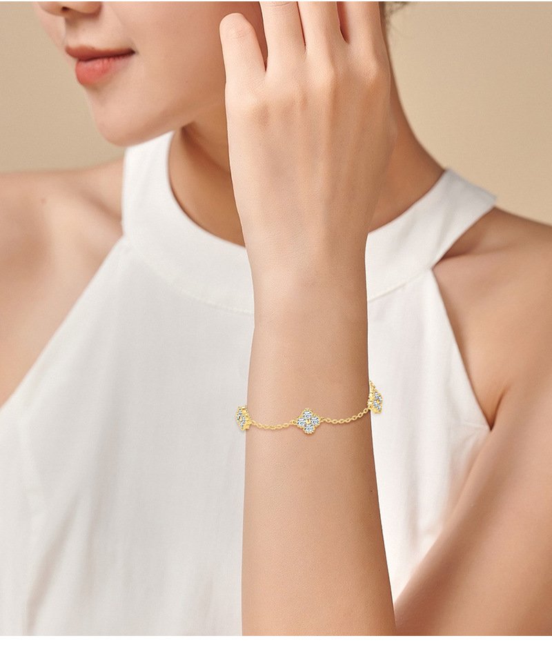 Close-up of five four-leaf clovers with moissanite on SYMARA bracele