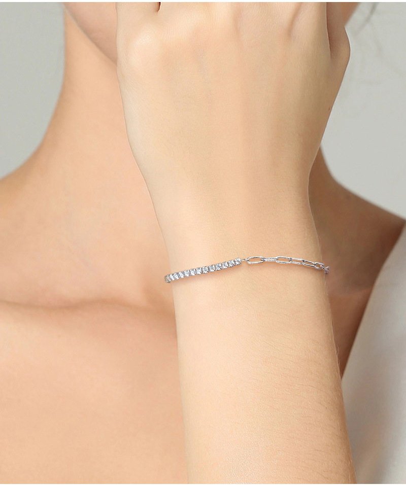 symara-half-paperclip-bracelet-on-wrist-stacked Close-up of D-color moissanite stones on SYMARA half paperclip bracelet