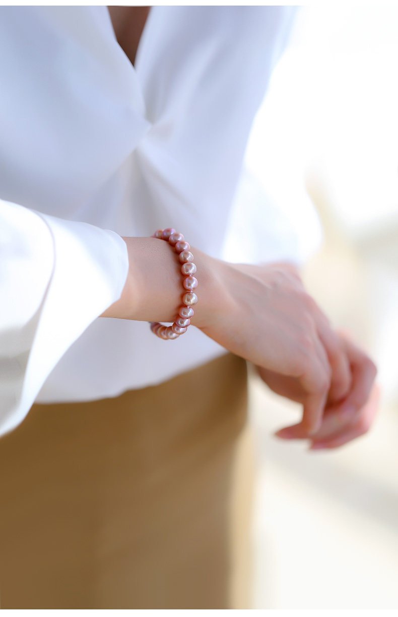 Close-up of natural pink-purple freshwater pearls showing unique color variations