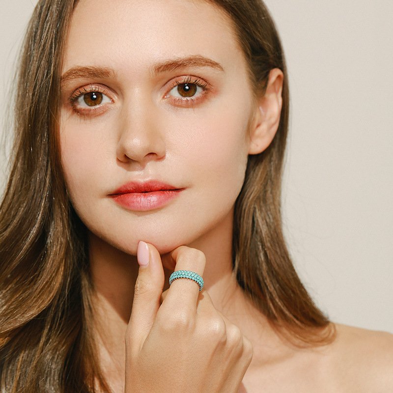 Model showcasing SYMARA vintage turquoise ring as a statement piece, perfect for boho and retro fashion outfits.