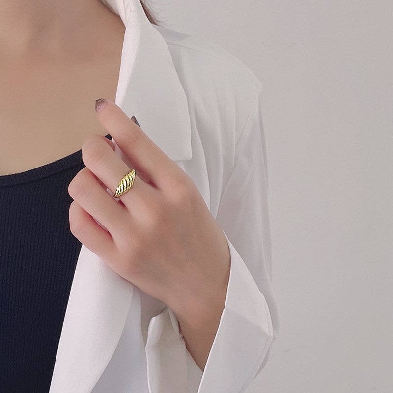 Model Wearing Gold Plated Croissant Twist Ring on Finger
