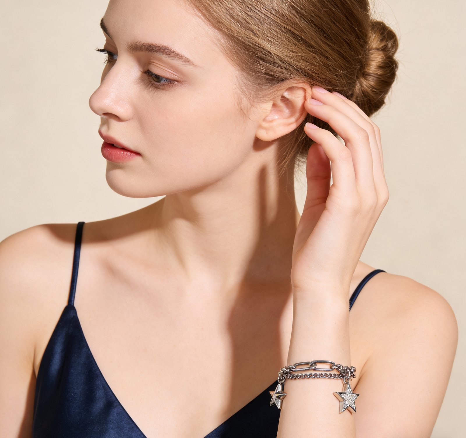 Adjustable vintage silver bracelet fitted on a woman's wrist, showing 16cm chain plus 3cm extension, secure lobster clasp, oxidized star charms catching light, comfortable hypoallergenic fit for sensitive skin.