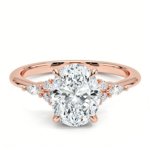 Nadia engagement ring in 14K rose gold, front view showcasing the cluster of oval and marquise lab‑grown diamonds along a tapered band.