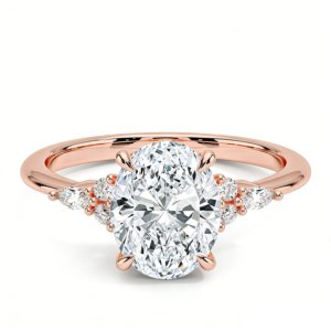 Nadia engagement ring in 14K rose gold, front view showcasing the cluster of oval and marquise lab‑grown diamonds along a tapered band.