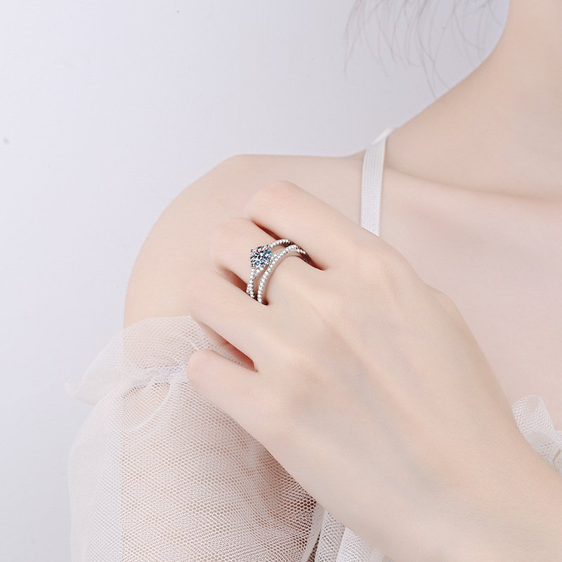 Model wearing 925 sterling silver 1 carat moissanite ring, light luxury Crossover hollow finger ring for women