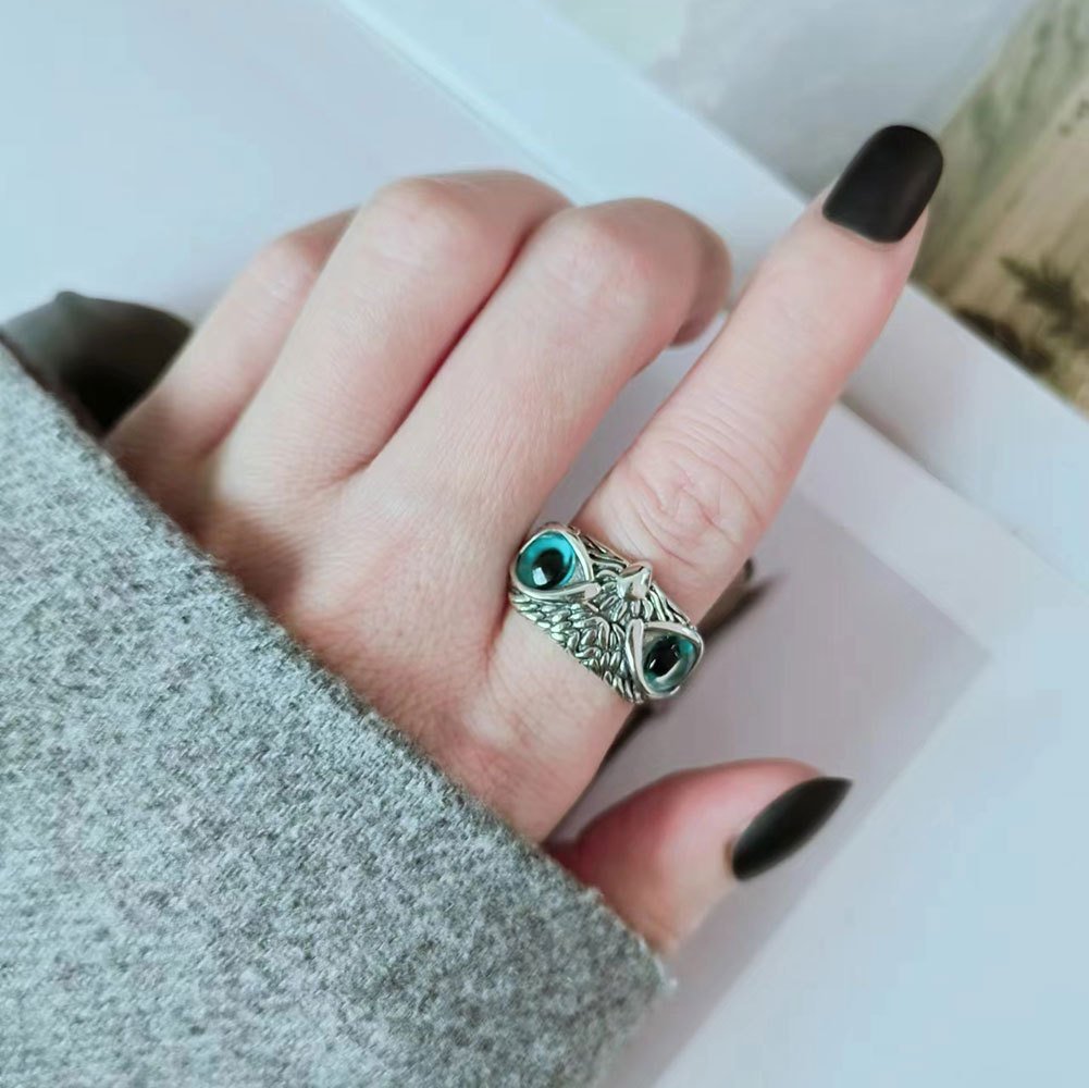 Woman wearing Blue-Eyed Owl Ring, adjustable open vintage ring, animal-inspired jewelry