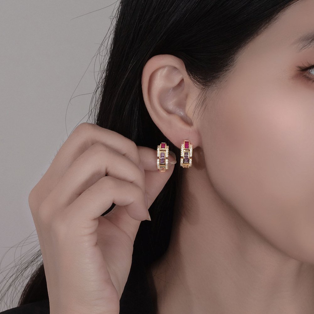 Woman Wearing Colored Diamond Geometric Hoop Earrings