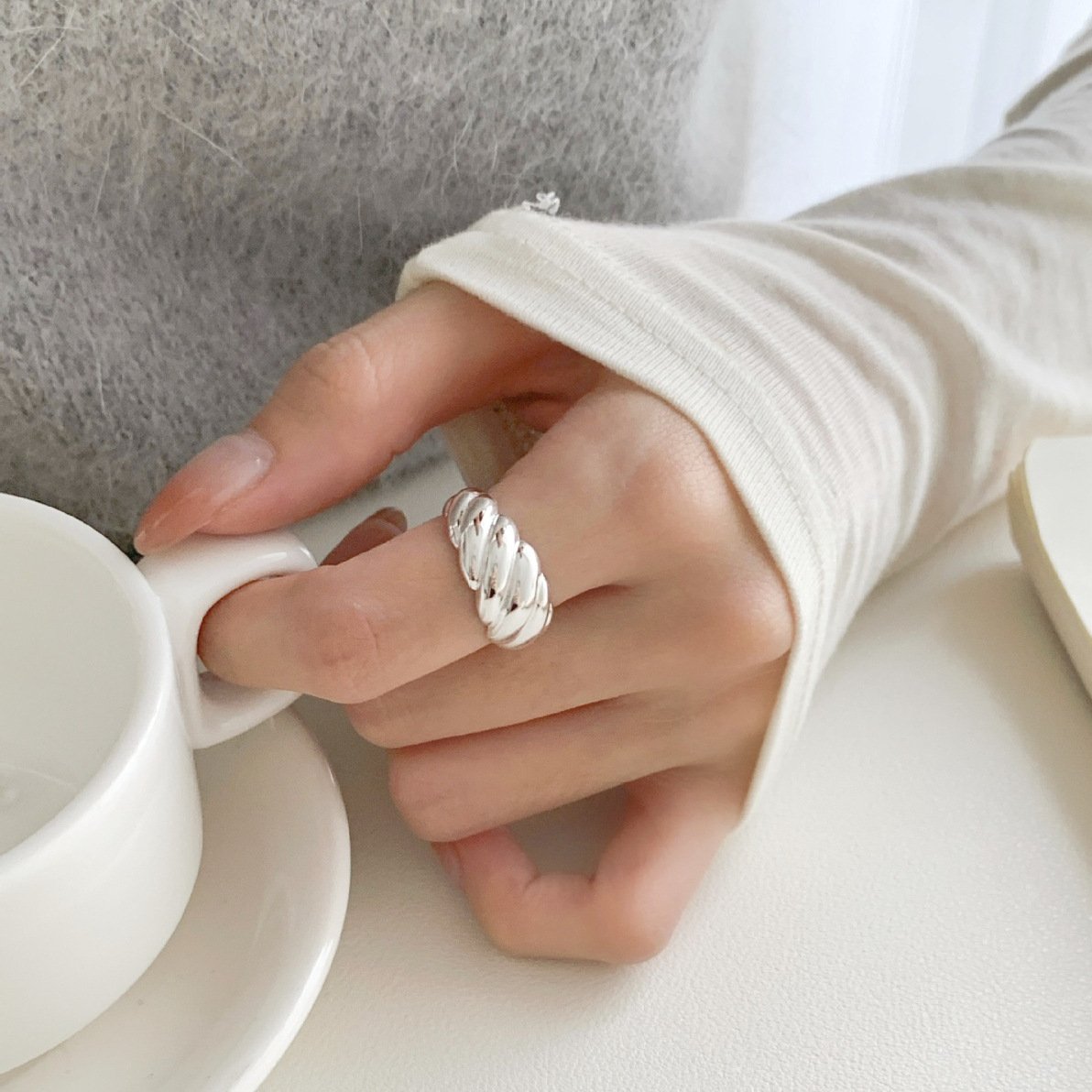 Model wearing SYMARA adjustable croissant ring, comfortable open band for everyday wear