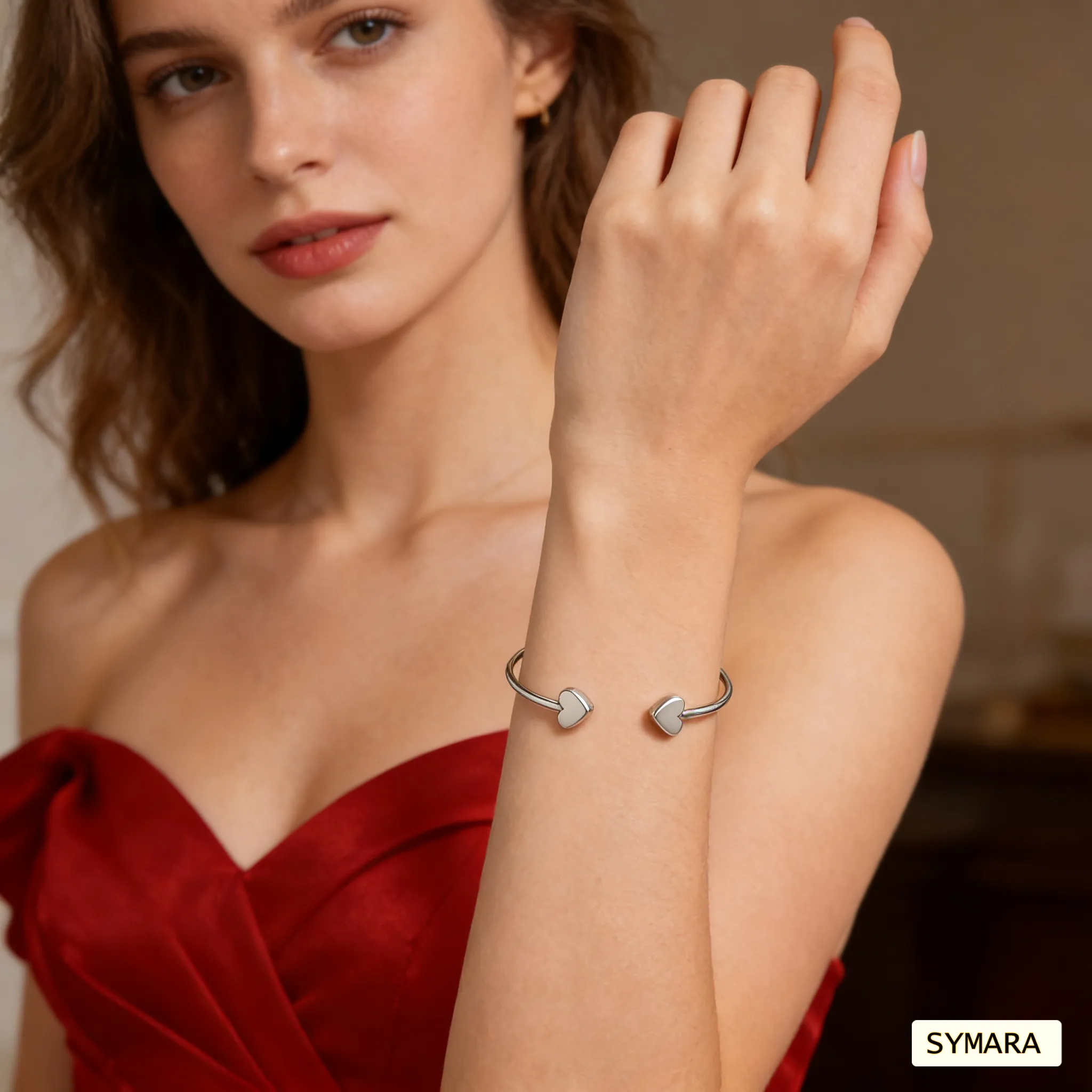 SYMARA classic heart bangle on wrist, White gold plated, catching natural light