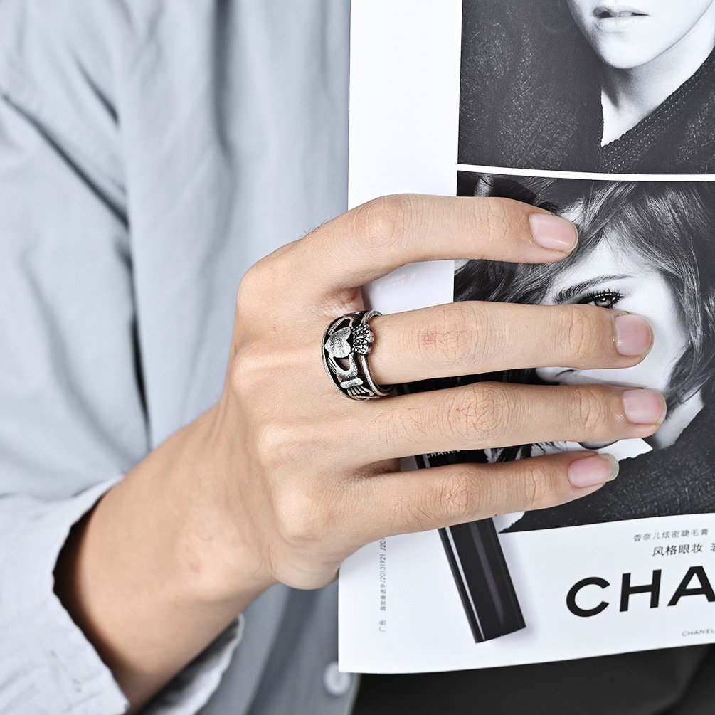 Model wearing black heart ring men on finger, vintage stainless steel heart ring for daily wear