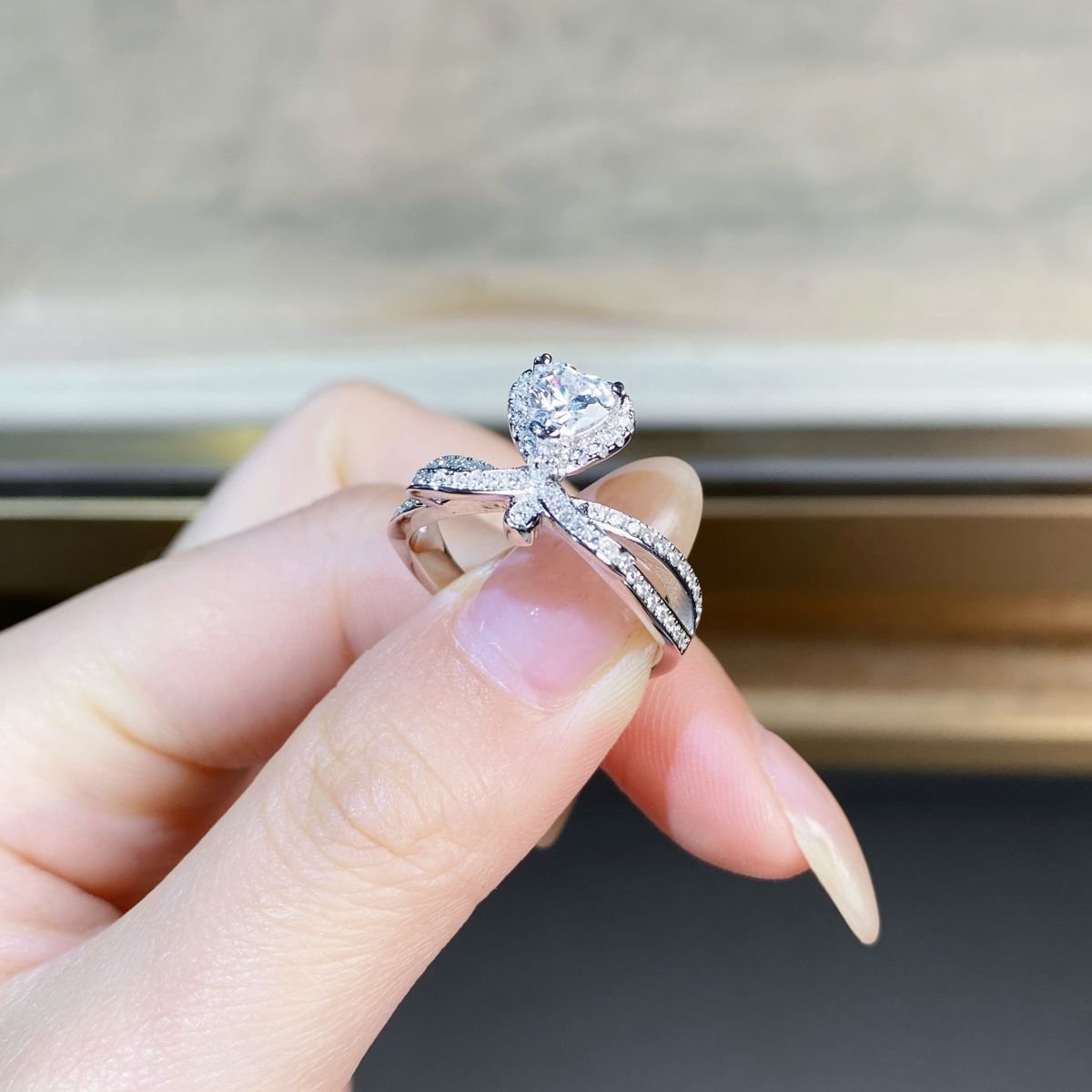 Simple heart moissanite ring with twisted ribbon band side view