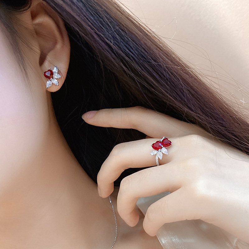 Minimalist jewelry double heart ruby ring worn on finger, elegant women’s anniversary style