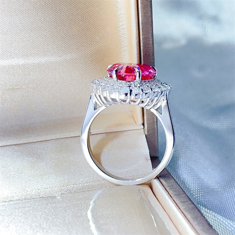 Detail shot of prong setting on pink heart moissanite ring, polished sterling silver