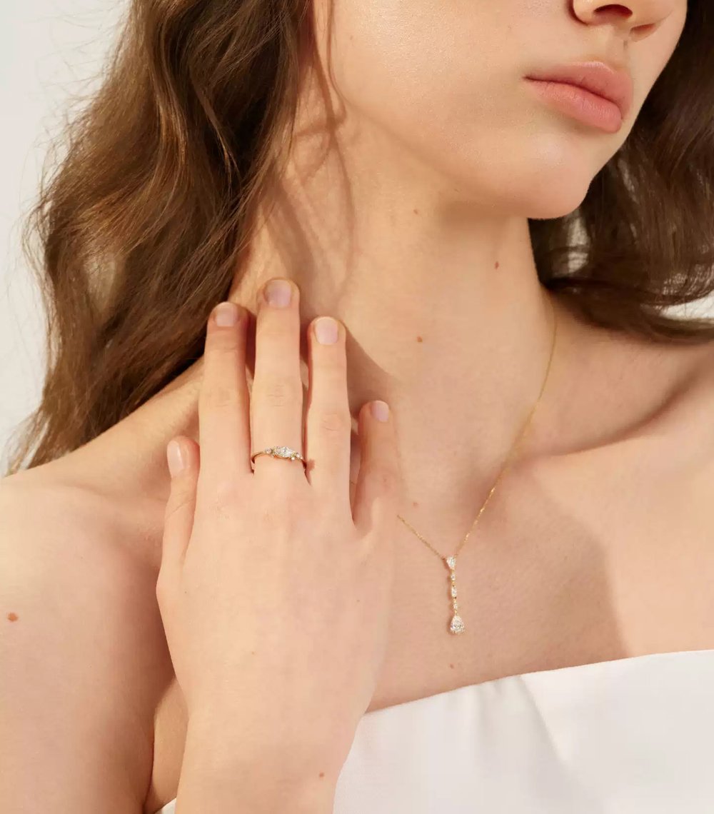 14k-gold-band-ring-worn-on-hand 14k gold band ring worn on a woman’s hand, showcasing elegant fit