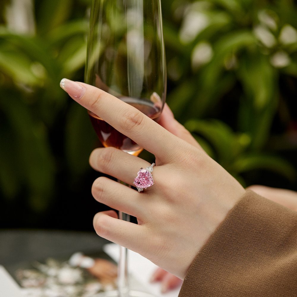wearing sterling silver pink heart ring on finger