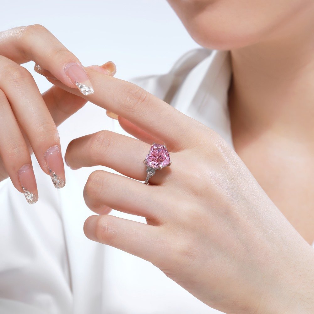model-wear-pink-heart-ring-finger-4 Model wearing sterling silver pink heart ring on finger