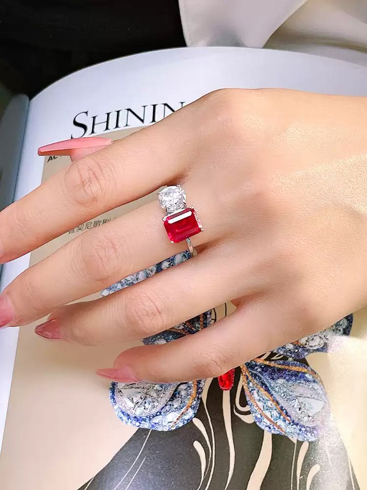model-wearing-toi-et-moi-birthstone-ring Side view of toi et moi birthstone ring showing prong-set ruby and diamond