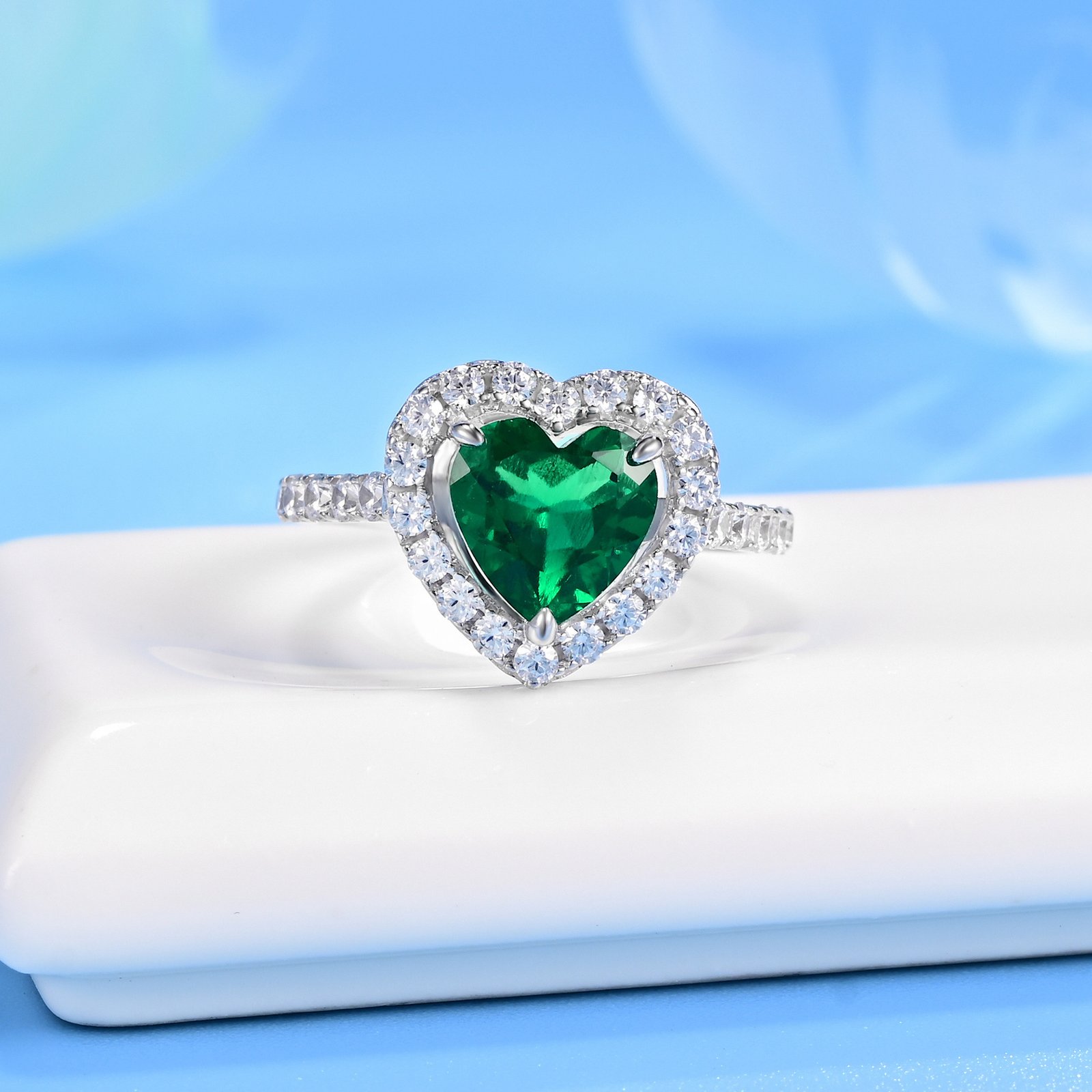 Emerald heart ring with double CZ halo
