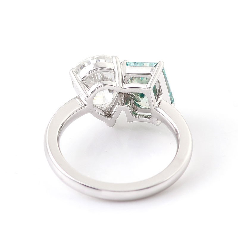 Side view of toi et moi engagement ring showing prong-set two stone design