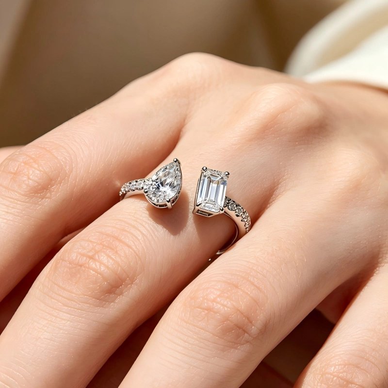 toi-et-moi-ring-on-woman-hand Woman wearing toi et moi diamond ring on finger, showcasing adjustable fit and half-eternity sparkle