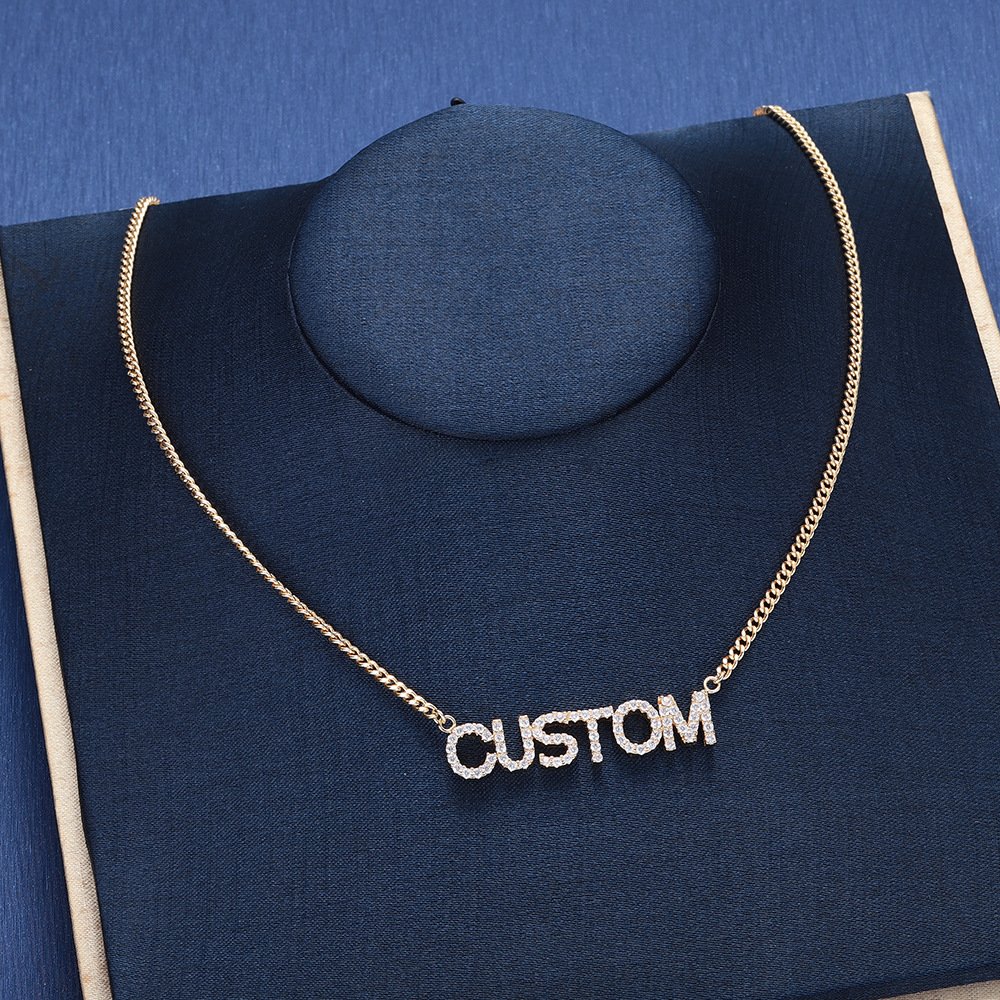 woman-wearing-custom-name-necklace-gold Gold Custom Letter Pendant necklace with zircon stones, hypoallergenic titanium steel design.