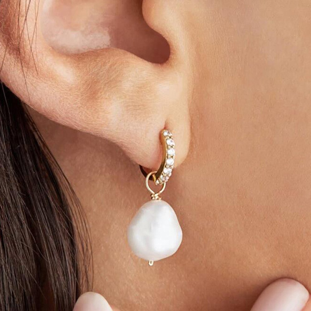 Large 12mm irregular baroque pearl Arlet statement earrings on model with formal evening outfit SYMARA
