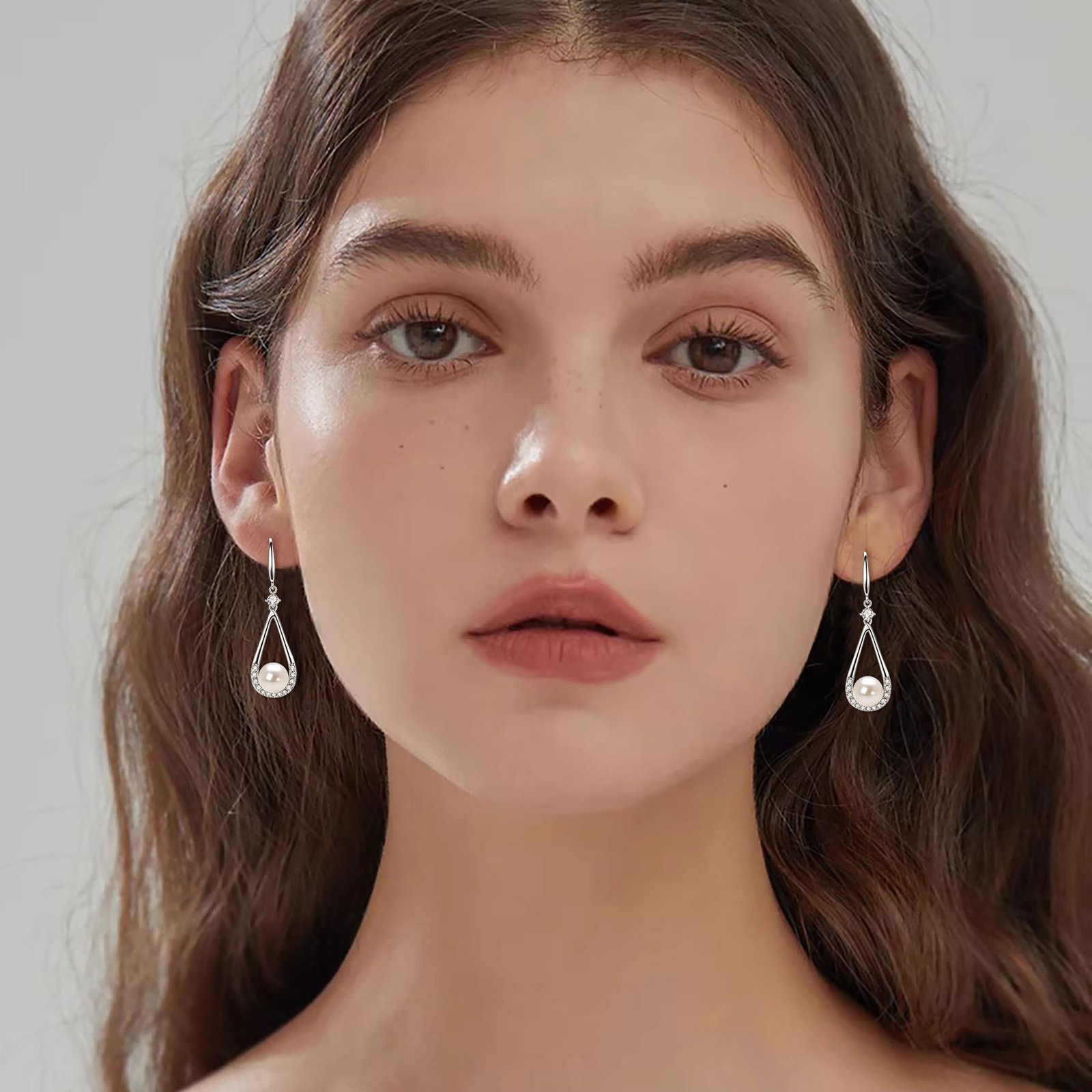Classic freshwater drop pearl Denise earrings with 7-8mm cultured freshwater pearls on female commute model SYMARA