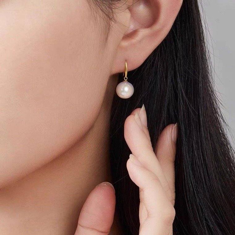 SYMARA minimalist 18K gold round pearl earrings paired with feminine outfits for romantic date occasions