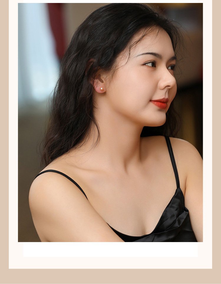 Female model wearing 7mm pink cultured freshwater pearl stud earrings daily commuter ear jewelry