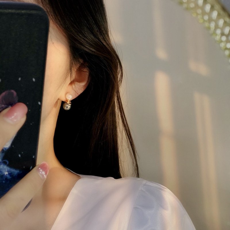 Female model styling Black Freshwater Pearl Becca Earrings for everyday office commute outfit