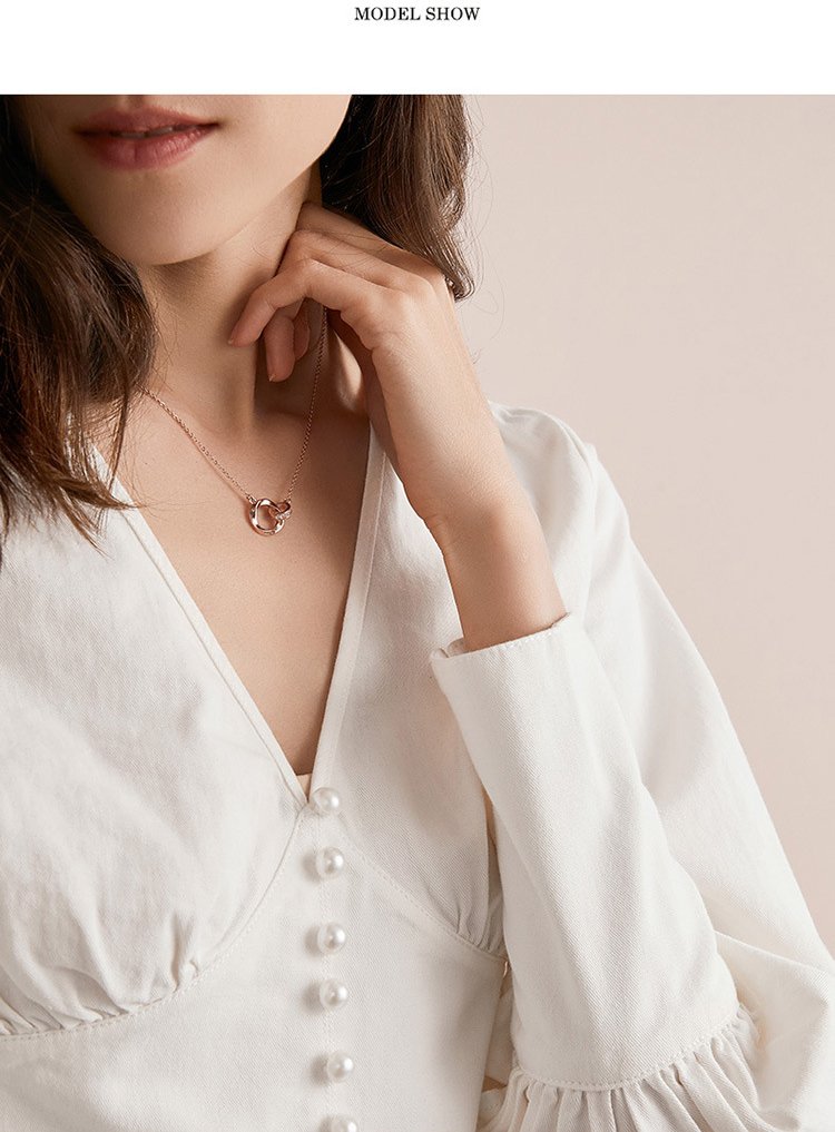 Woman wearing mobius ring necklace, delicate S925 silver collarbone chain for everyday wear