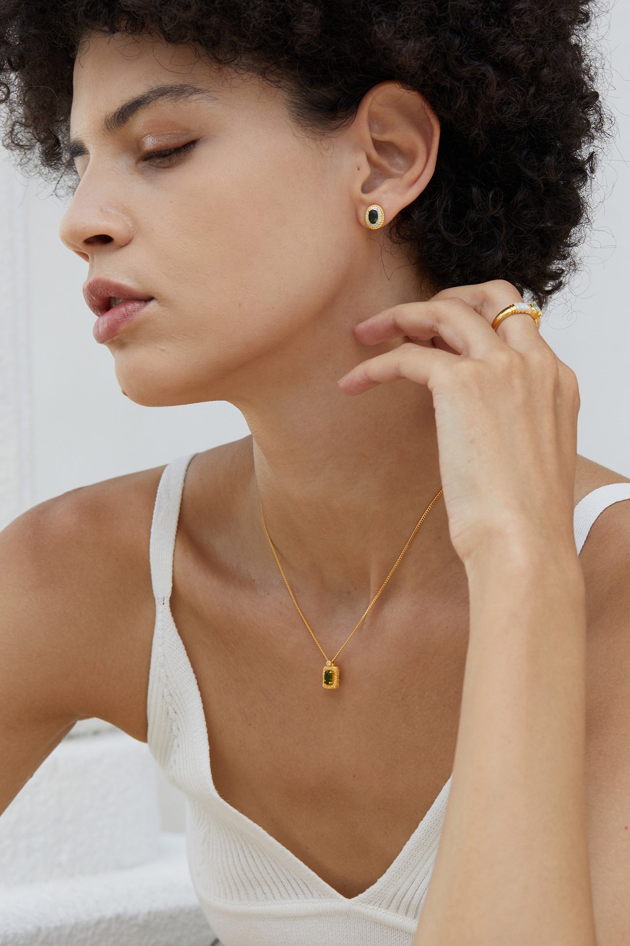 Elegant woman wearing 18K gold plated square diopside clavicle necklace for romantic date night styling
