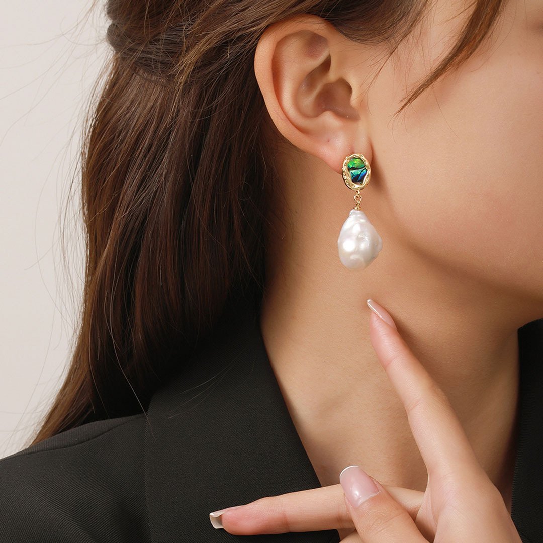 Female model wearing French style baroque freshwater pearl abalone drop earrings for daily casual outfit