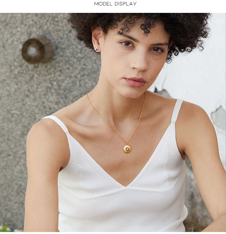 Young girl wearing reversible star and mother-of-pearl niece necklace