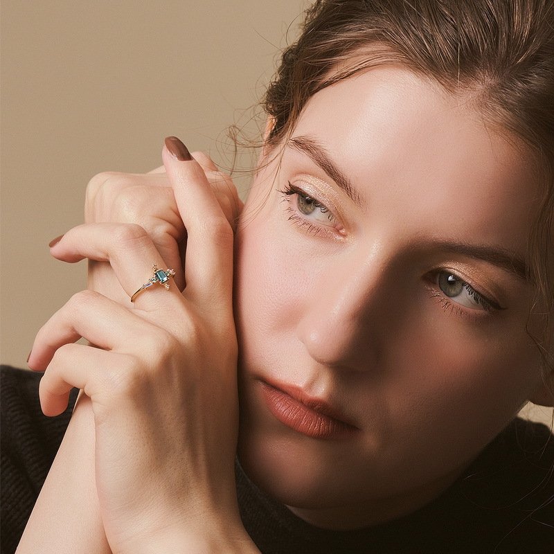 Art Deco sunburst detail on the topaz ring, highlighting vintage-inspired gold craftsmanship
