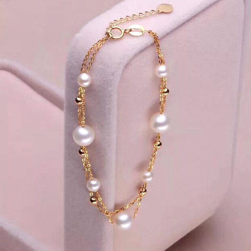 Close‑up of near‑round high‑lustre freshwater pearls 6‑7mm and 4‑5mm for double‑layer bracelet