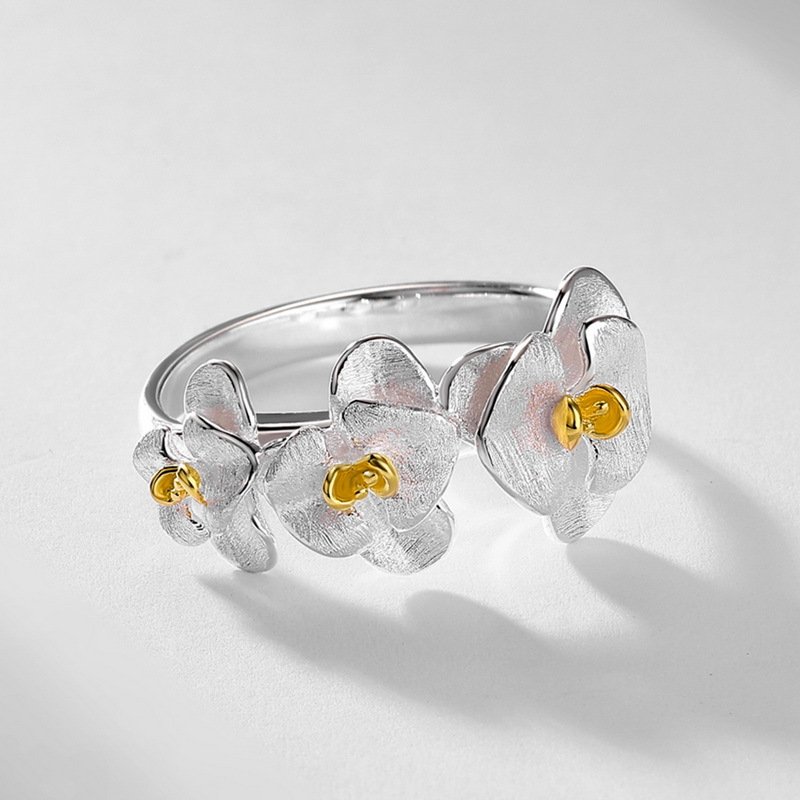 Delicate cascading orchid flower ring with two‑tone finish, hypoallergenic silver everyday jewelry