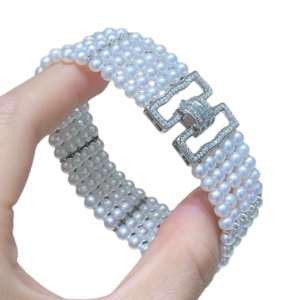 Luxury five‑row wide baya freshwater pearl bracelet 3‑4mm round high lustre pearls on plain white background