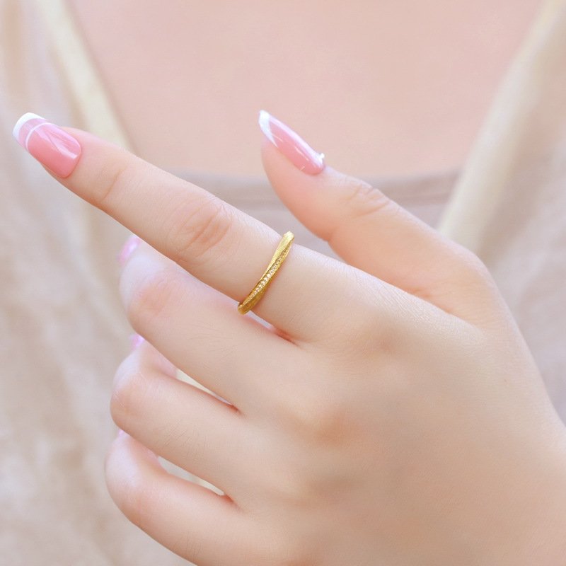 moebius-ring-stacking-idea Minimalist Buccellati style Moebius ring styled in a jewelry stack with other thin rings, perfect for everyday outfits
