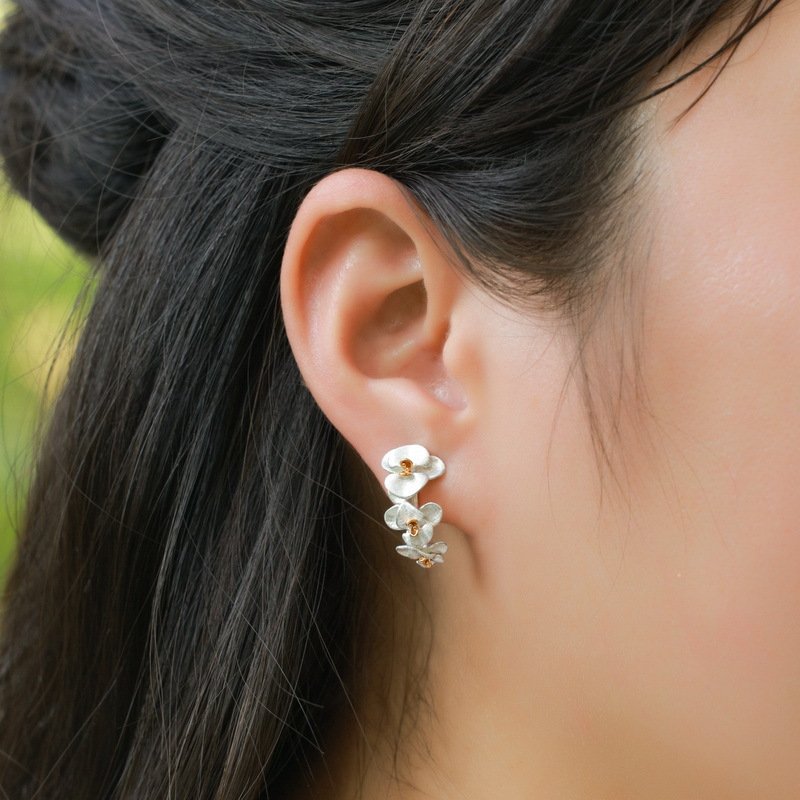 Phalaenopsis orchid stud earrings styled for everyday and office wear, nature-inspired delicate jewelry
