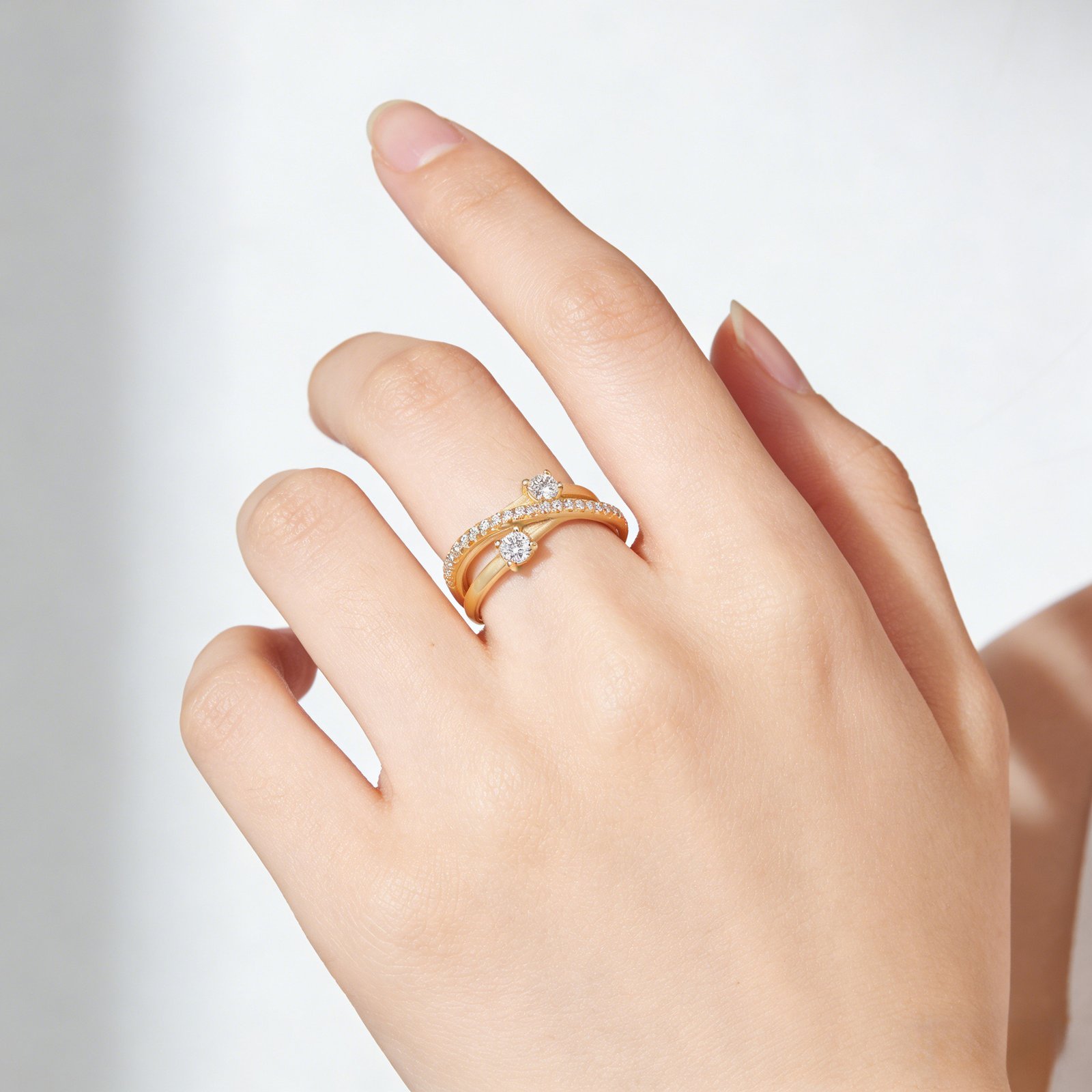 S925 silver crossover pinkie ring worn on hand, stacked with thin bands