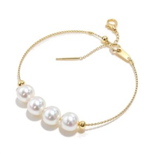 SYMARA dainty 18K gold Akoya seawater pearl bracelet with three 6-7mm round bright luster pearls, studio shot