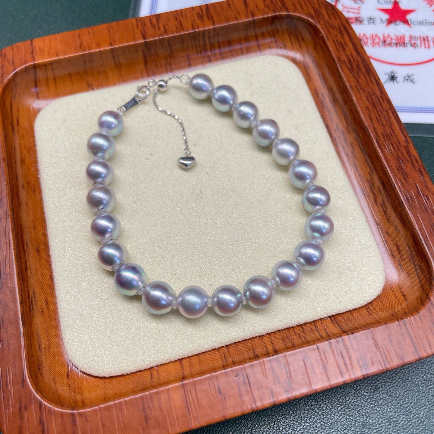 6-7mm round Akoya seawater pearl bracelet worn on wrist, elegant everyday fine jewelry for office commute