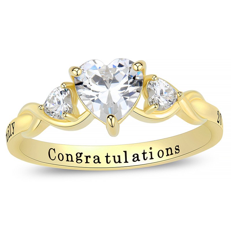 Close-up shot of heart shaped birthstone custom graduation ring with inner band engraving