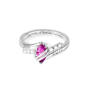 Close-up of marquise birthstone custom graduation ring with cubic zirconia side stones and outer band engraving